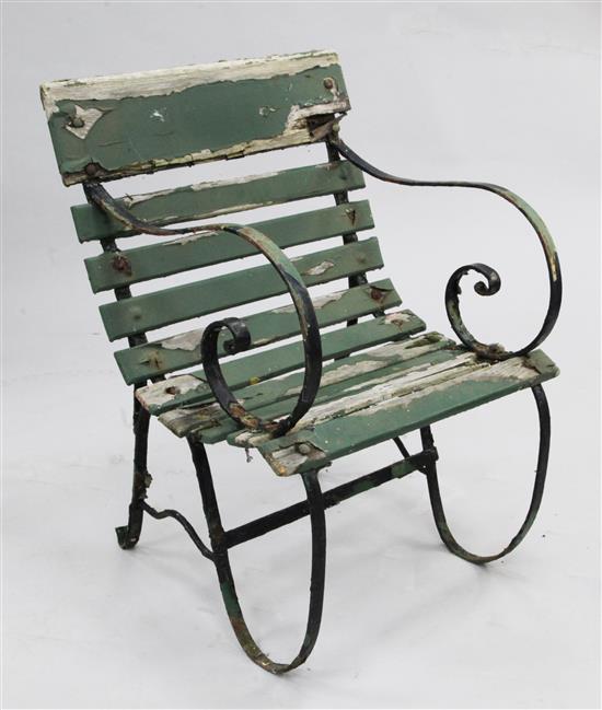 A green painted station armchair,